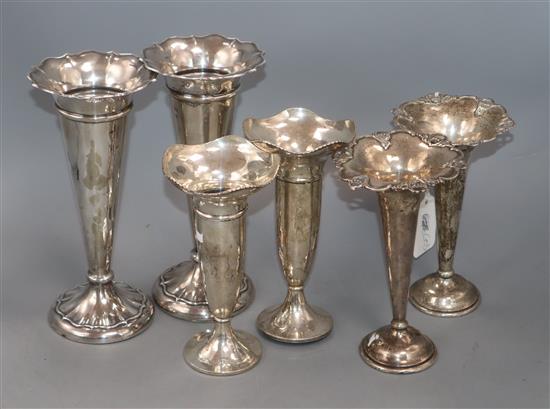 Three assorted pairs of early 20th century silver posy vases, including Mappin & Webb and Elkington & Co, tallest 21.5cm.